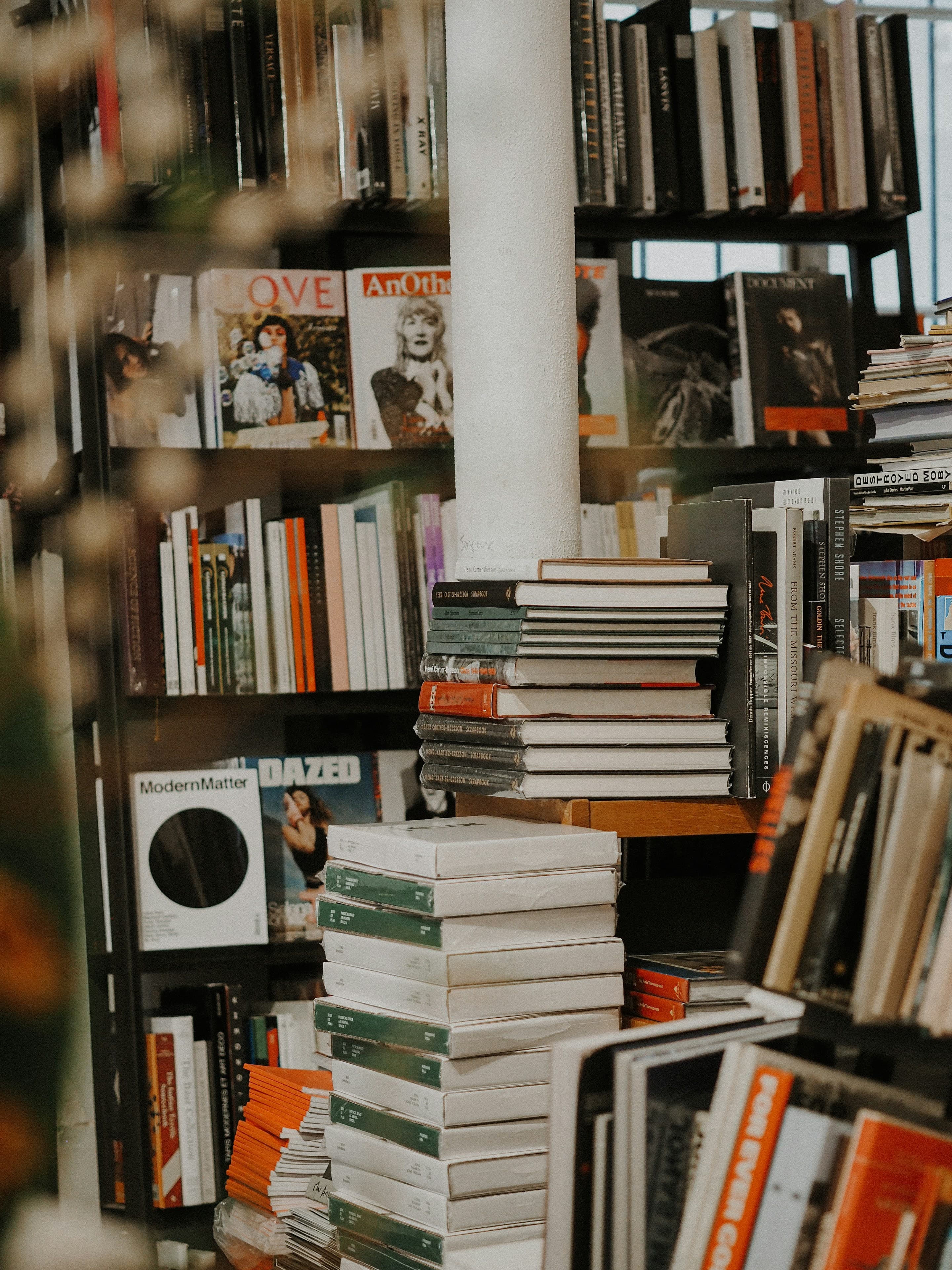 Books stacked in a warm library setting